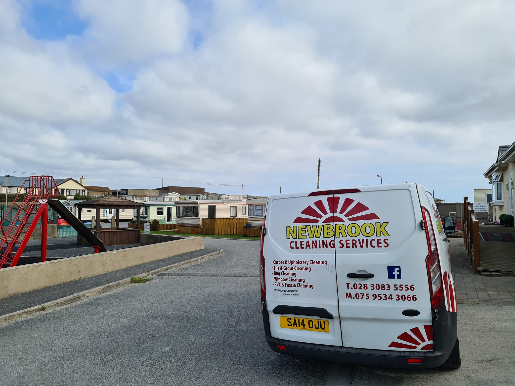 Rear of the Newbrook Cleaning van showing service categories